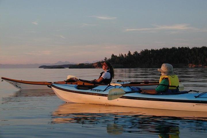 kayakers at sunset