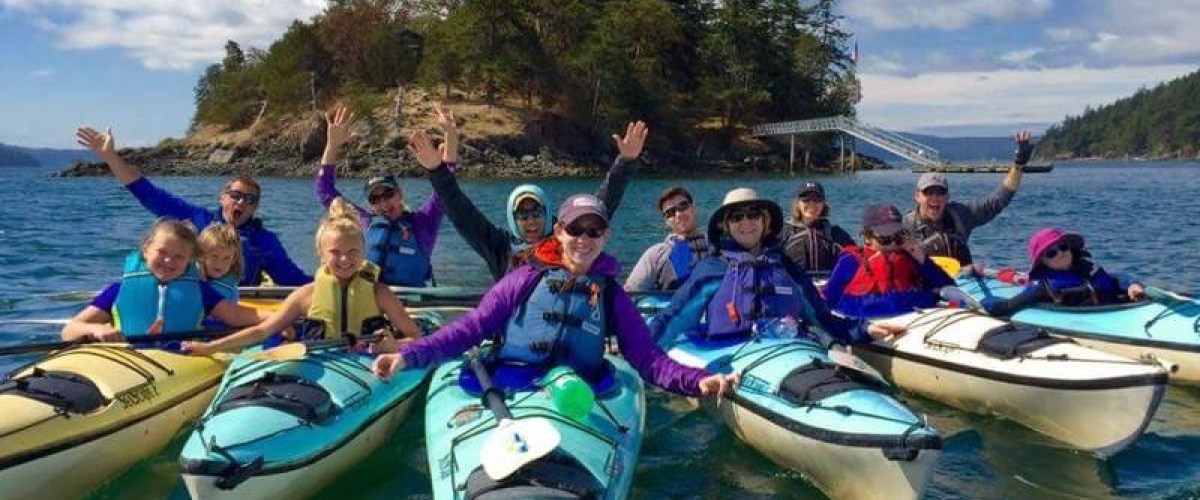 happy family in kayaks