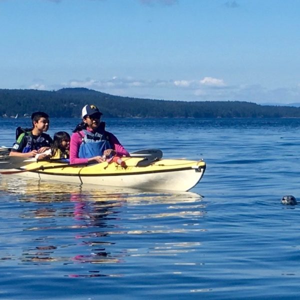 mom and kids in a kayak