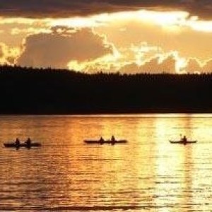 sunset over a group of kayaks