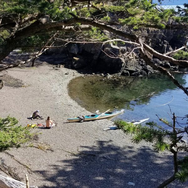 kayaks on a pebble beach