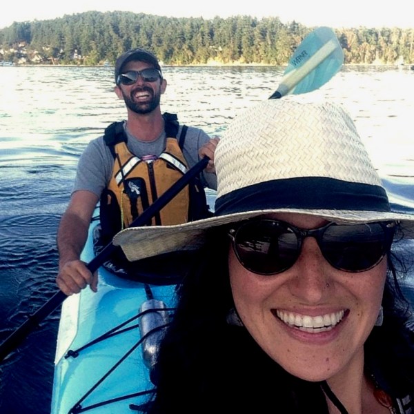 2 people smiling in a kayak