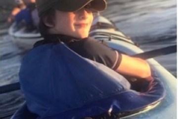 a young boy wearing a hat