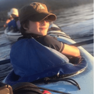 a little boy wearing a helmet