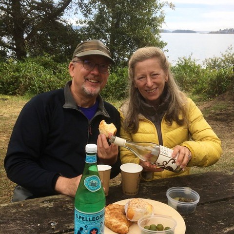 enjoying lunch at a picnic table