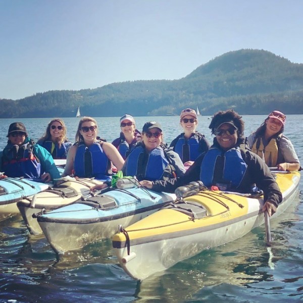 a group of people in kayaks in the water
